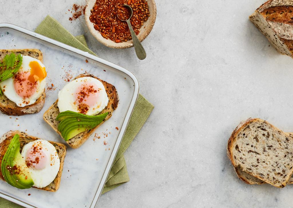 Poached Eggs with Avocado and Dukkah Serves 2 4 SLICES OF BAKERS DELIGHT AUTHENTIC MIXED SEED SOURDOUGH LOAF 4 EGGS, POACHED 2 AVOCADOS, FINELY SLICED 2 TSP DUKKAH SEASONING Toast the slices of