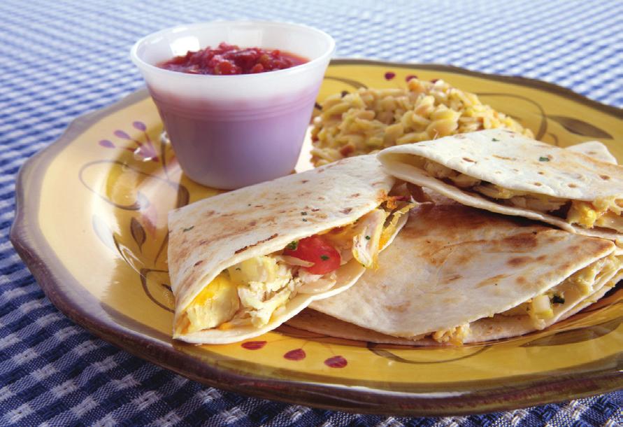 CHICKEN QUESADILLAS Makes 4 servings Serving Size: 1 quesadilla 1 cup chopped, cooked chicken 2 tablespoons salsa 1/4 cup chopped white onion Non-stick vegetable cooking spray 1/4 cup canned chopped