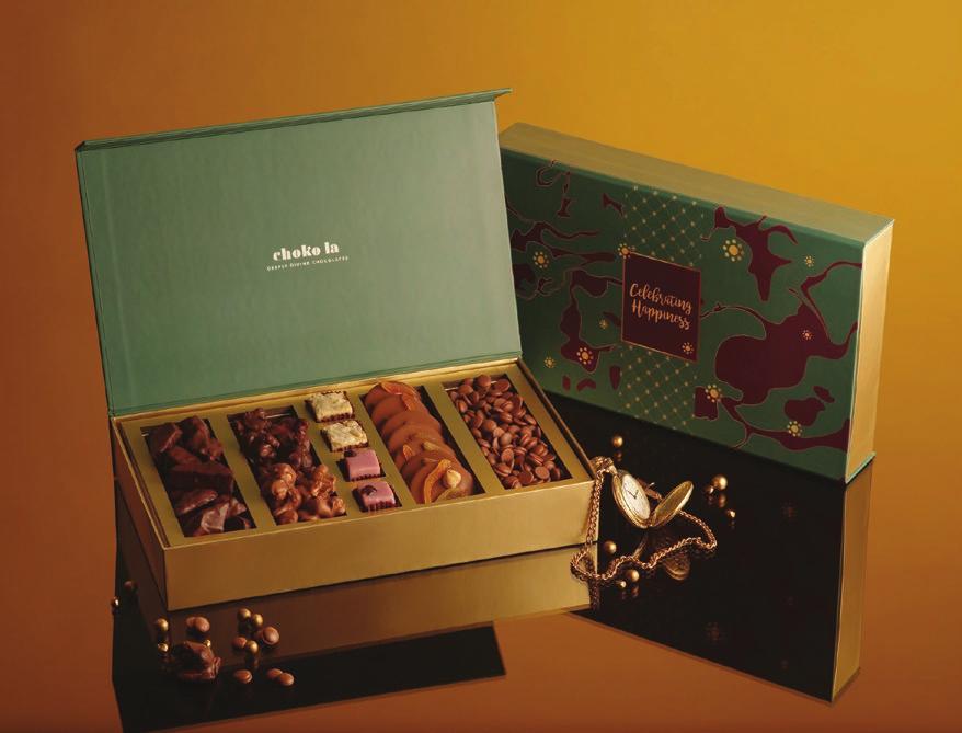Indulgence Delve into a box brimming with goodies like Milk Mendiants, Bite Size Milk Chocolate,