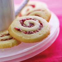 Cranberry-Orange Pinwheels Makes about 60 cookies 1 cup cranberries 1 cup pecans 1/4 cup packed brown sugar 1 cup butter, softened 1-1/2 cups granulated sugar 1/2 teaspoon baking powder 1/2 teaspoon