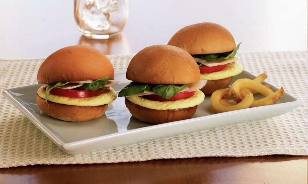 Egg and tomato SliderS Egg and tomato SliderS Yield: SERVING (3 SLIDERS) Papetti s Table Ready Round Egg Patties #30008 mini burger buns 3 tomato, sliced basil leaves Asiago cheese, sliced 3 3 slices