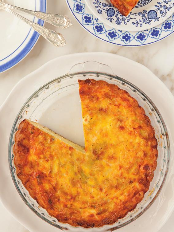 Coat the bottom and sides of a 10-inch glass or ceramic quiche dish with nonstick cooking spray. 2. In a large nonstick skillet, heat butter over medium heat until melted and sizzling.