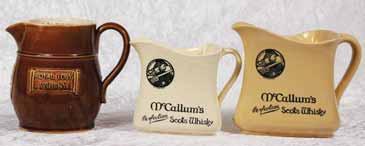 MITCHELL S 6ins tall, character jug, words to rim, MITCHELL S OLD IRISH WHISKY, & MITCHELL S OF BELFAST LTD, to base on sides, Made in England, prof repair to spout & hairline to base of handle, 184.