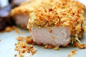Coat pork chops in crumb mixture. Dip in egg mixture and into crumbs again. Pour melted butter into baking dish.