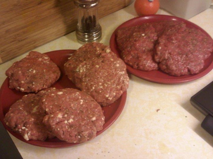 Burgers 1 lb ground beef 2 cloves garlic, minced 2 tbs olive oil 1 ½ tsp salt 1 tsp freshly ground pepper ½ tsp dried basil Cheese for topping 4 hamburger buns 1 lb ground beef 2 oz