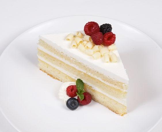 Three layers of moist white cake filled with a tart lemon cream frosted with smooth lemon