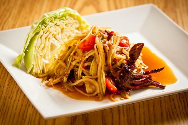 Papaya Salad $6 ( Served as spicy Lao style shredded green papaya with tomatoes, Thai peppers and house sauce.