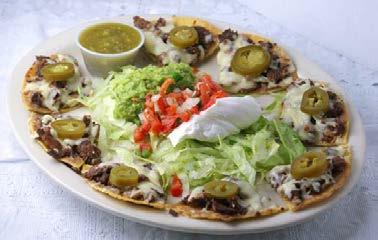 12.75 Grilled steak or chicken or both cooked with bell peppers, onions and tomatoes on a bed of cheese nachos topped with