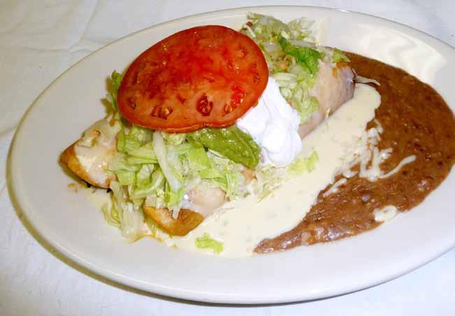 Special Dinners All changes will be charged extra. Steak La Poblana Your choice of steak, chicken or tilapia on a bed of grilled poblano peppers, onions, mushrooms, tomatoes and white cheese.