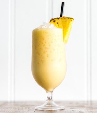 Top 12 Cocktails 1. PINA COLADA A holiday classic reimagined.