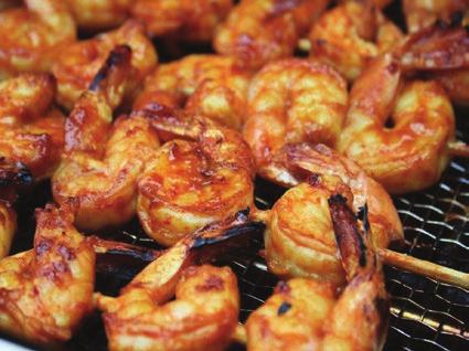 Place shrimp in a dish and add the marinade, tossing to coat. Let marinate in the fridge up to two hours. Thread on prepared skewers and grill over medium heat until done (turns pink), turning once.