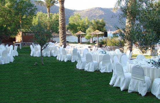 The standard set up of either venue includes round tables, dressed chairs and white linen.