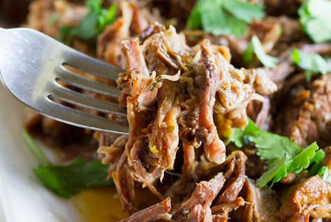 BEEF SPICY CHIPOTLE SHREDDED BEEF FOR BURRITOS OR TACOS 2-3 lbs beef roast (the pot roast cut) 1 onion (peeled quartered) 1 green pepper (seeded quartered) 5-6 chipotle peppers 1 cup fresh cilantro,