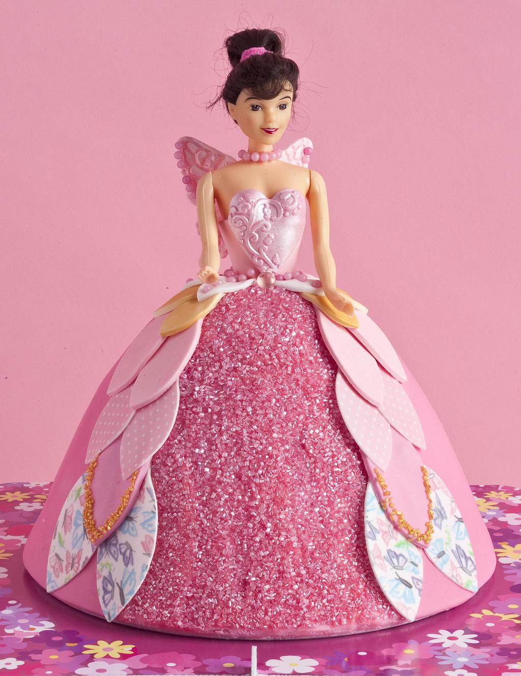 Princess Doll Cake You will need; Sponge cake baked in Wilton Wonder Mould Pan (includes doll set) Butter icing to cover cake 8 round cake board Professional Pink Regalice Sugar Paste Shell Pink