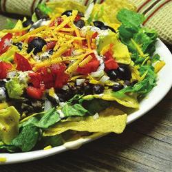Touchdown Taco Salad Serves 8 1. ½ pound lean ground Beef 2. 1 ½ cups (6 ounces) shredded Cheddar cheese, divided 3. ½ cup Salsa, divided 4. 8 cups Salad greens 5. 1 cup chopped Tomato 6.