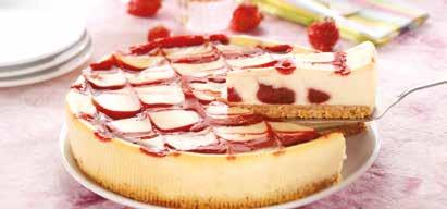 55 A crunchy digestive biscuit base with a traditional New York style cheesecake rippled with white chocolate blossoms and juicy strawberry pieces and feathered with strawberry coulis.
