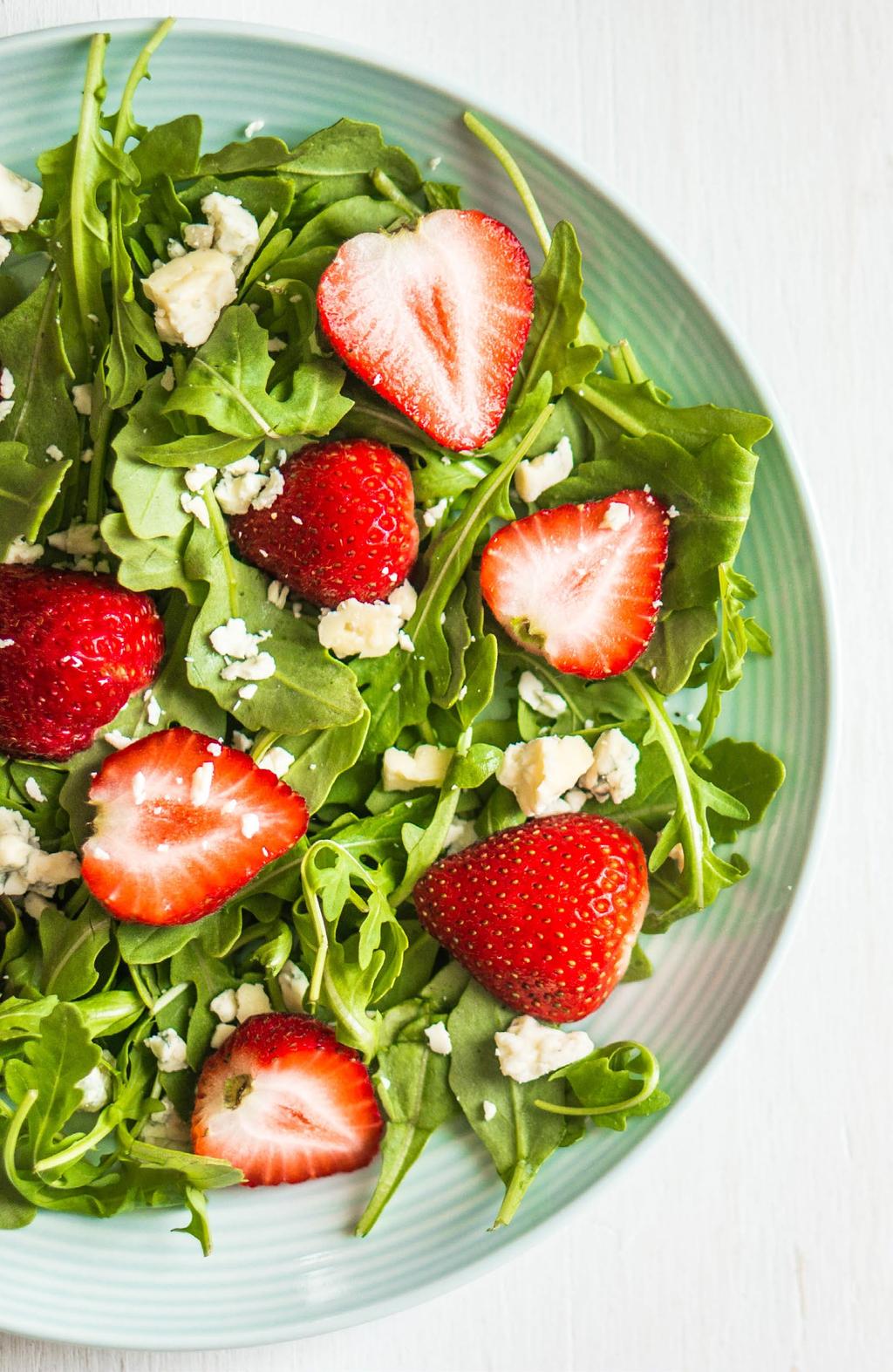 ARUGULA AND STRAWBERRY SALAD 2 SERVINGS 1 bunch arugula, washed, dried, and torn 1 cup fresh strawberries, washed, hulled, and cut into quarters or halves ½ - 1 tablespoon extra-virgin olive oil ½ -