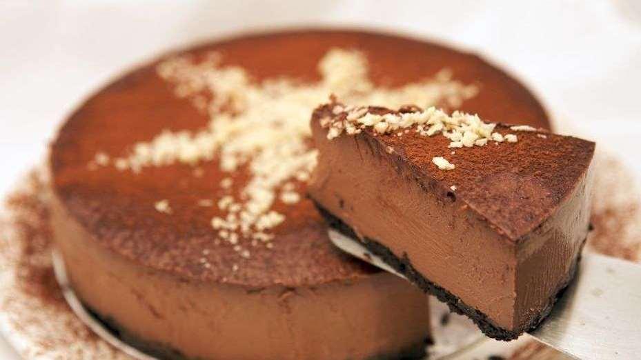 50. CHOCOLATE CAPPUCCINO CHEESECAKE 1 cup chocolate cookie crumbs 1/4 cup butter, softened 2 tablespoons white sugar 1/4 teaspoon ground cinnamon 3 (8 ounce)