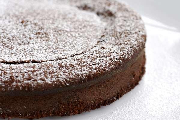 51. FLOURLESS CHOCOLATE ALMOND CAKE For the Cake Batter: 2½ cups blanched almonds, toasted, and finely ground 2 tablespoons, plus 1¼ cups granulated sugar, divided ½ cup unsalted butter, room