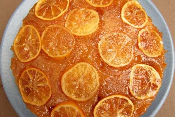 54. LEMON UPSIDE DOWN CAKE Topping: 2 large or 3 small lemons ¼ cup (½ stick) unsalted butter ¾ cup