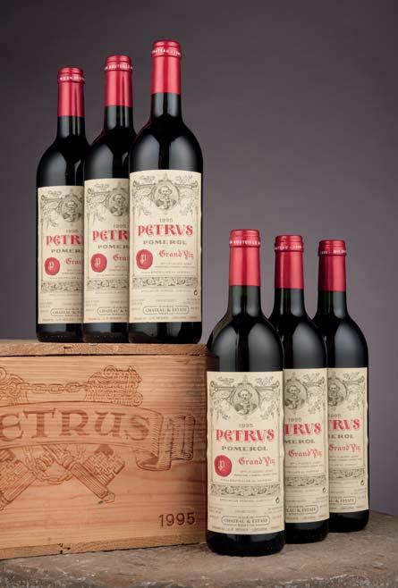CHATEAU PETRUS Château Pétrus 1990 One top shoulder, two very high shoulder level; two labels torn, one slightly damp stained...sweetness, low acidity, and velvety tannins.