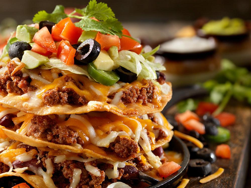 Traditional Mexican mexican tostada Time 30 Min Serves 12 1 can (28 oz) Keystone Ground Beef 8 corn tortillas, fresh 2 cups of oil (for frying) the tortillas 1 can (15 oz) refried beans 1 large onion