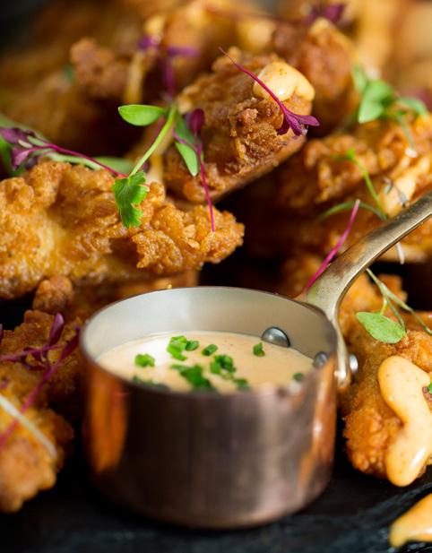 popcorn chicken, a wide selection of pizzas, as well as beers, wines, and spirits.