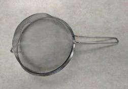 A sieve or a sifter is used to separate materials.