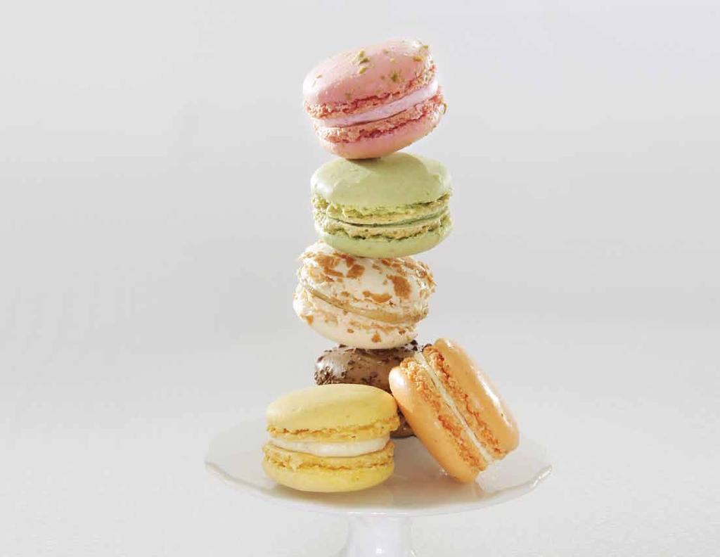 Macaroons Our Macaroons are two demi-spheres of light almond meringue toned pastel shades to represent their wonderful flavors sandwiched around our intensely flavored cream.
