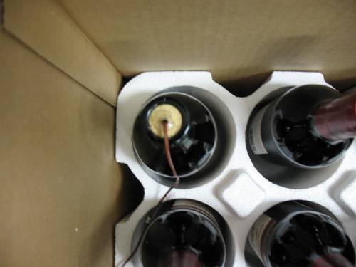 A hole was drilled into the cork of each wine bottle in order to place the thermocouple
