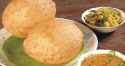 garnished with ghee Poori Fried fluffy whole wheat bread served with mashed potato curry Parotta Delicious south Indian fluffy bread served with two curries Chappathi Thin soft whole wheat bread