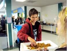 (Left) Student taking some vegan sausage samples at one of my school vegan