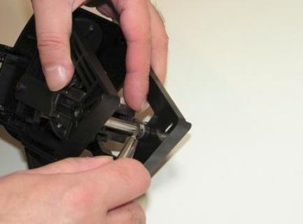 Use the nose pliers to remove the C clip washers.