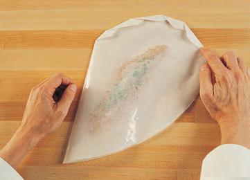Lay the lemon slices on top. 3. Fold and crimp the parchment, as shown in the illustration, to enclose the fish tightly. 4.