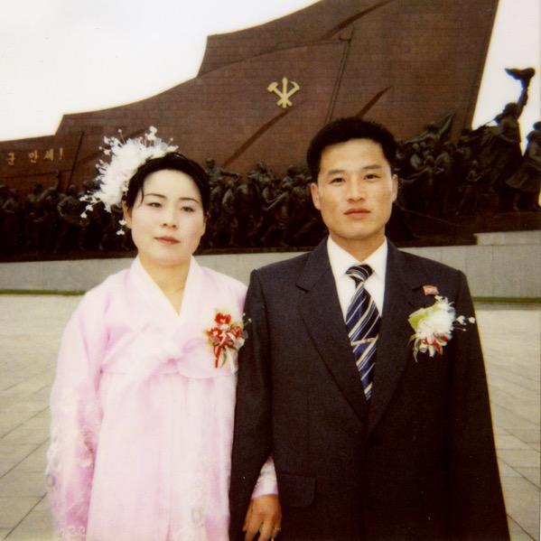 Every new couple come to Mansudea hill to pay respect to the dear Leaders statues in Pyongyang on the day of their weddings. From their faces, it seemed that this was not a happy moment!