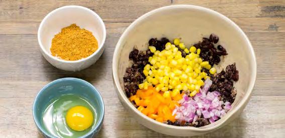 2 Add Chipotle Lime Rub, red onion, bell pepper, and corn. Mix in the egg.