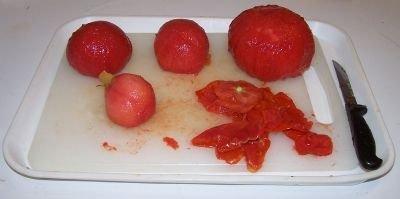 Step 3 - Removing seeds and water After you have peeled the skins off the tomatoes, cut the tomatoes in