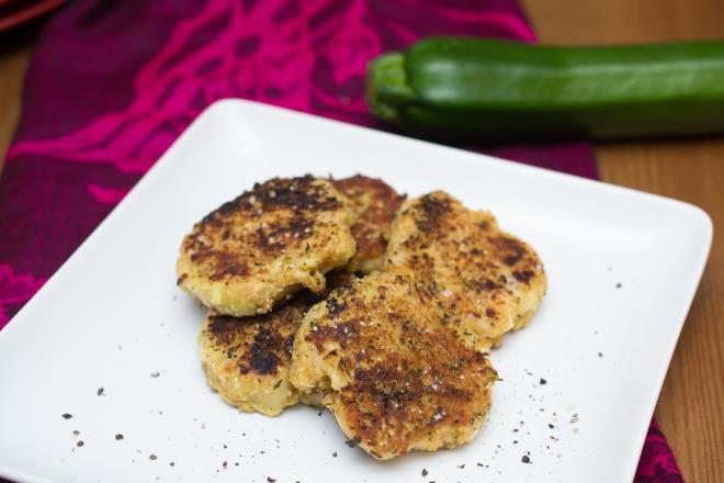 Zucchini Patties 2 cups grated zucchini 2 eggs, beaten 1/4 cup chopped onion 1/2 cup all-purpose flour 2 cloves garlic, minced 1/2 cup grated