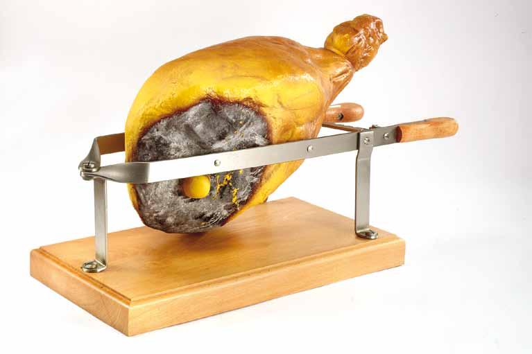 Slicer Carving Board with Removable Spikes Long grain reversible hard rock maple carving board. Features hand grips, juice grooves with reservoir and removable spikes to secure the meat to the board.