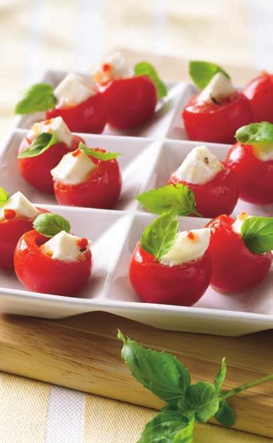 If necessary, cut small slice from bottom so tomato stands upright. Place tomatoes on serving plate or tray. 2 In small bowl, toss cheese and dressing.