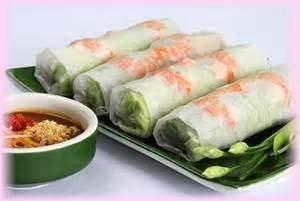 50 Prawns, fried tofu, cucumber, onion, cilantro green leaves rolled in rice paper, served with peanut sauce 04 - Coconut Prawn......... 7.