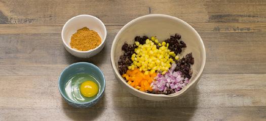 Add Chipotle Lime Rub, red onion, bell pepper and corn. Mix in the egg.