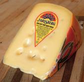 1kg) Kilo A mild cows milk cheese with large irregular holes, originating from Jarlsberg, Norway.