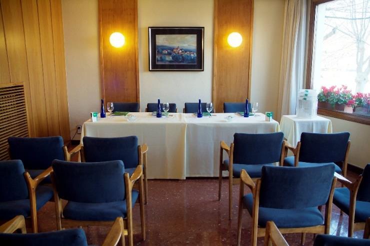 Meeting room with the equipment: High-tech lounge equipped at your convenience, paper-block, pen, mineral water.