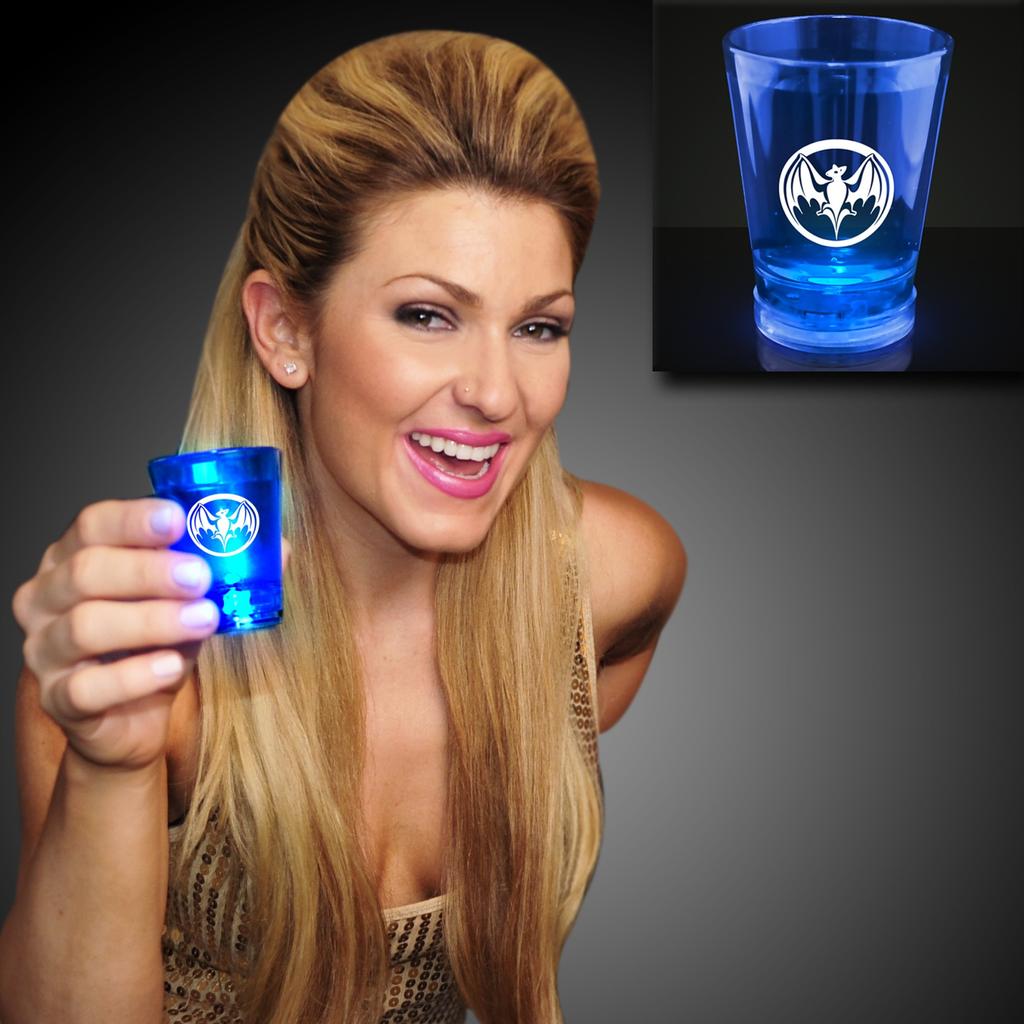 60 Day 2 Oz. Customizable Blue Light Up Shot Glass Customized Blue Light Up Shot Glasses will dazzle and delight guests. A sleek design, high quality acrylic and luminous LEDs showcase your logo.