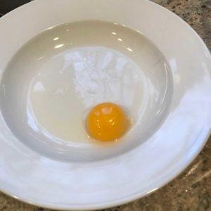Make your egg wash by beating either an egg yolk or