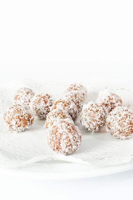 Lemon Bliss Balls MAKES 20 BALLS CALORIES PER BALL: 103 1 cup dates (soaked for 15min) 1 cup of almonds 1/2 cup desiccated coconut, plus extra for rolling Juice of 1 large lemon 2 Weet Bix, crushed 1.