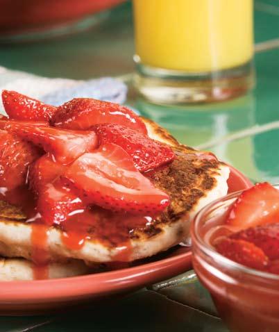 Banana Berry Pancakes 1 large banana, peeled and sliced 1 cup complete pancake mix ½ cup water nonstick cooking spray Topping 1 cup unsweetened frozen strawberries, thawed and sliced 2 tablespoons