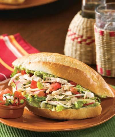 Chicken Tortas 2 cups cooked, shredded chicken 1 teaspoon chili powder 2 cups Pico de Gallo (see page 9) 2 cups shredded romaine lettuce 4 thin slices white onion ½ cup shredded reduced fat Monterey