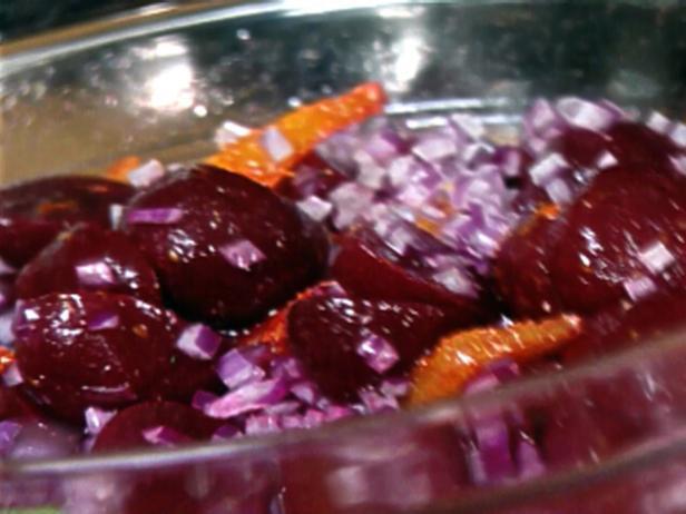 Beets with Orange Vinaigrette 4 to 6 servings 3 (15-ounce) cans baby beets, drained 2 tablespoons raspberry vinegar 2 tablespoons freshly squeezed orange juice 3 tablespoons good olive oil 1 1/2